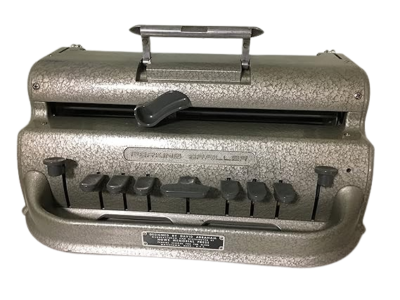 A Perkins Brailler, a mechanical typewriter-like device used for writing Braille, featuring six keys, a space bar, and a handle on top.