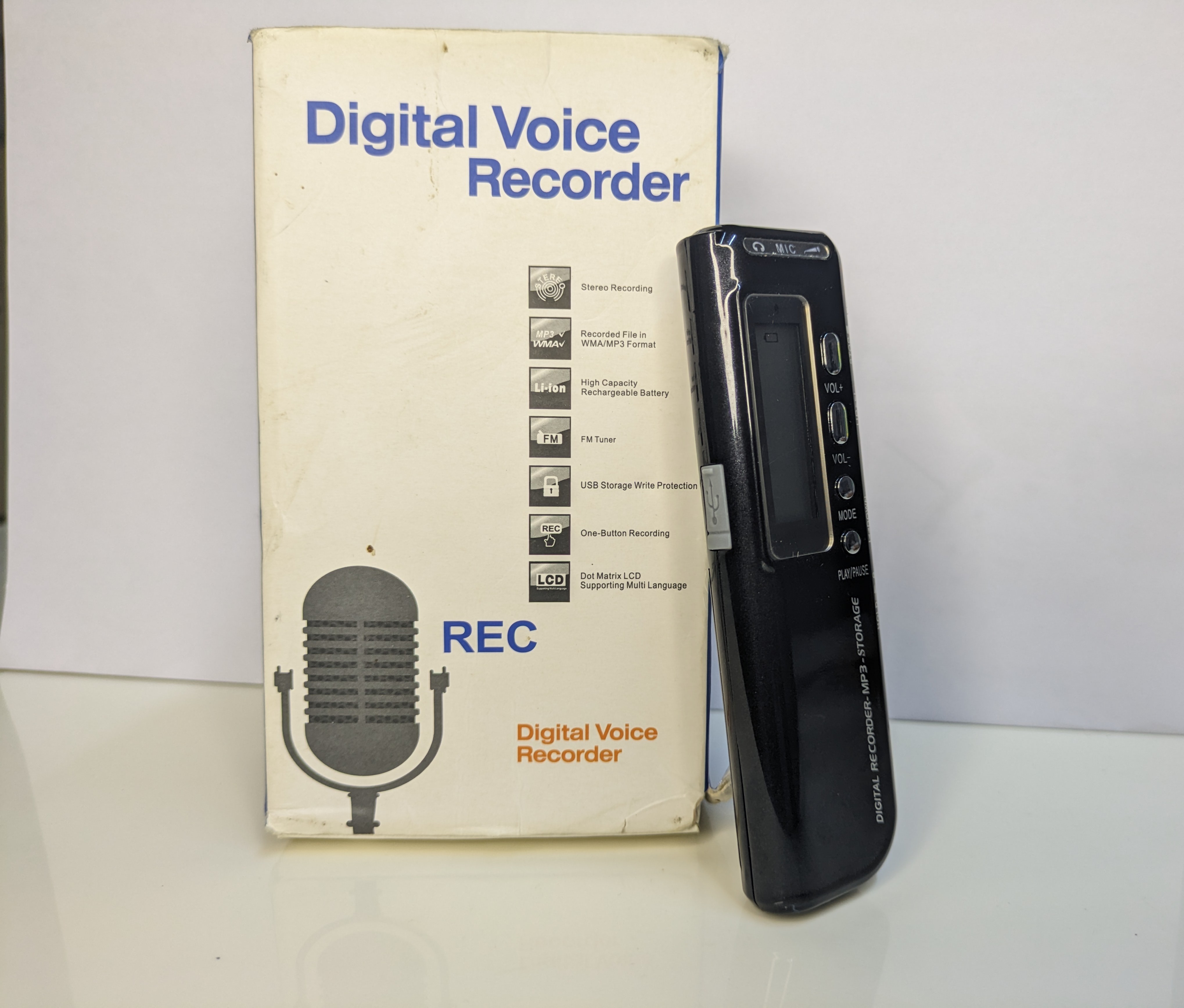 Sleek digital voice recorder with compact design, featuring intuitive buttons and screen for easy use.