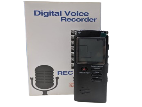 A digital voice recorder is shown in front of its packaging. The packaging has the text "Digital Voice Recorder" and an image of a microphone. The recorder itself has a display screen and several buttons, including ones labeled "REC/STOP" and "PLAY."